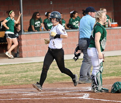 Image: Bailey Eubank(1) crosses home plate for an Italy run.