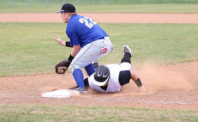 Image: Rice respects the speed: The Bulldogs force John Byers(18) back to the bag. The last time that happened was about a hundred pounds ago leaving “J.B.” to admit he forgot to close his mouth.