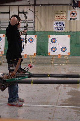 Image: Hunter Hinz of Italy aims for the bullseye and finishes in 6th place in the intermediate compound aided boy’s division.