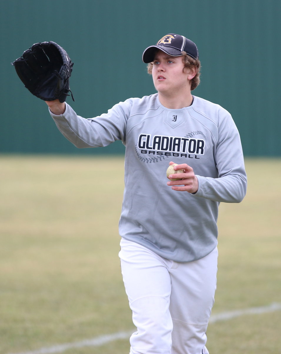Image: Bailey Walton keeps his teammates warmed up.