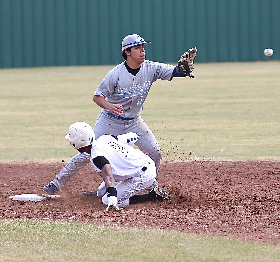 Image: Eric Carson(2) slides safely into second-base.