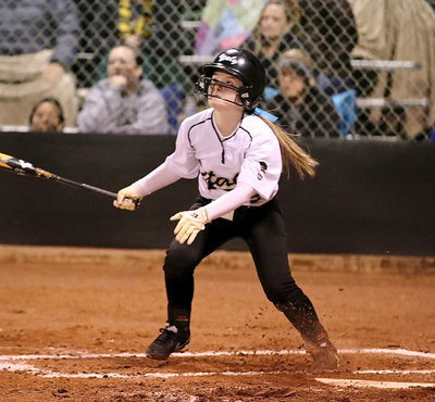 Image: Tara Wallis(5) tries to loop a shot over the Panther infield.