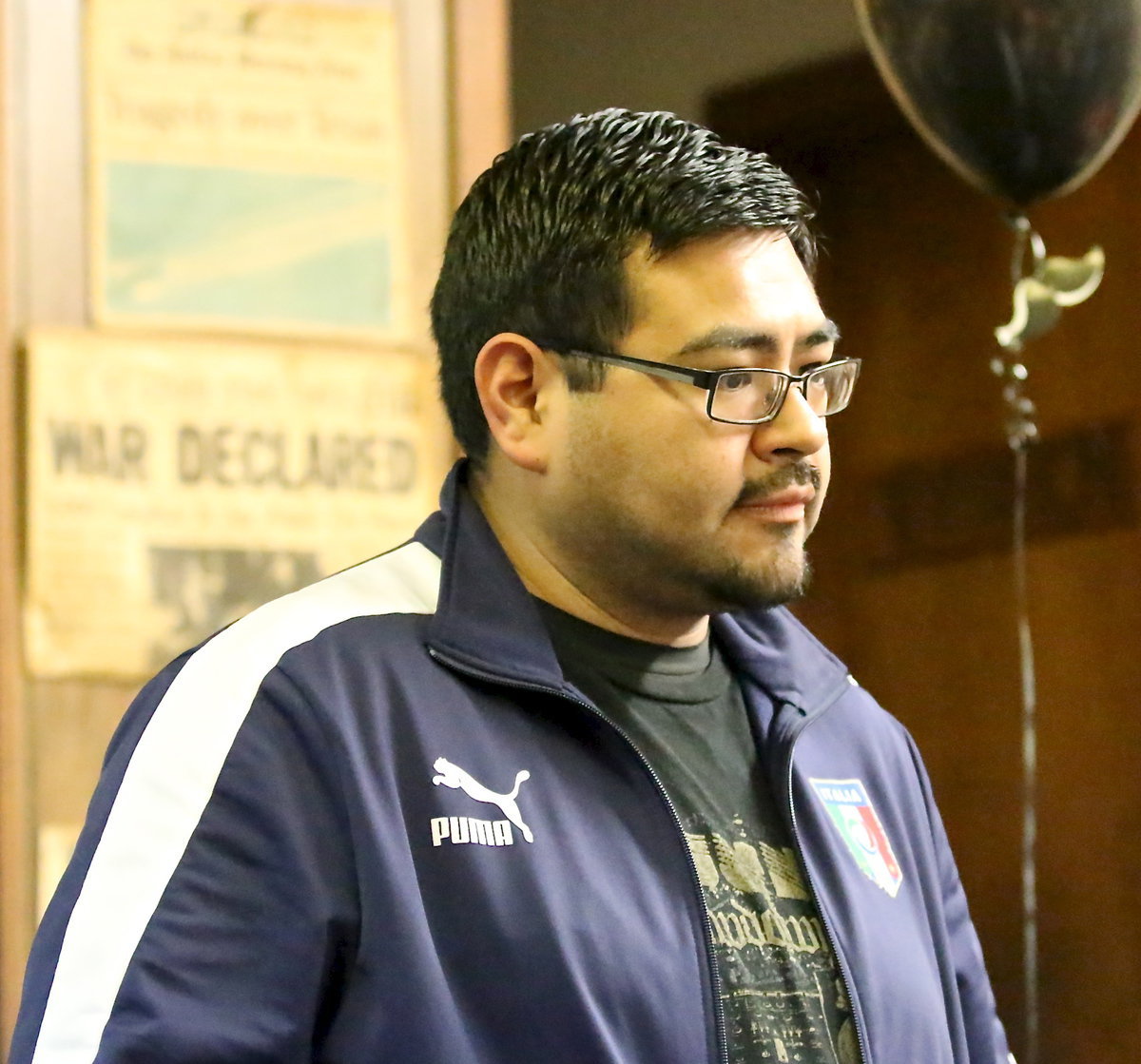 Image: Band director Jesus Perez seems to be fixated on a plate of spaghetti.
