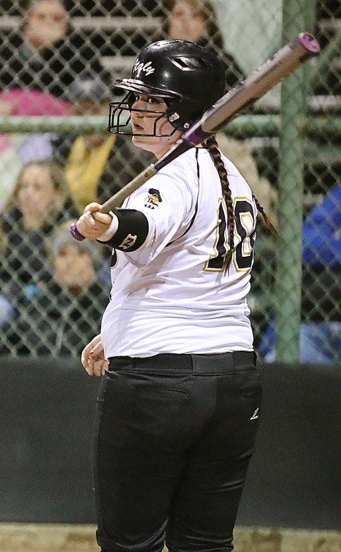 Image: Paige Westbrook(18) checks with head coach Wayne Rowe at third-base before stepping into the batter’s box.