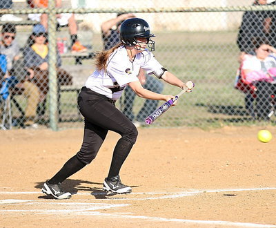 Image: Hannah Washington(8) bunts the ball into play for Italy.