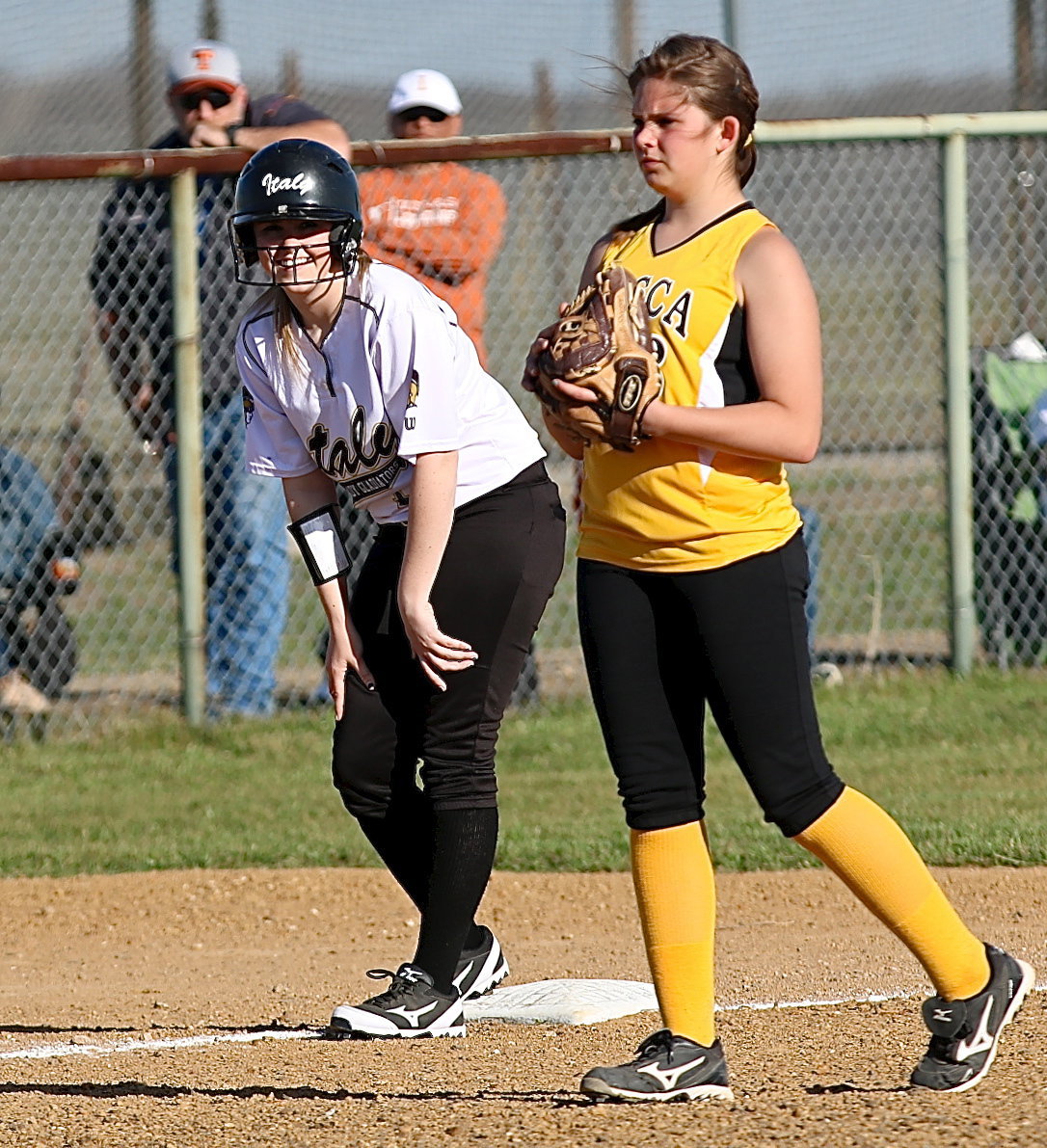 Image: Italy’s Kelsey Nelson(14) is happy to be on third-base.