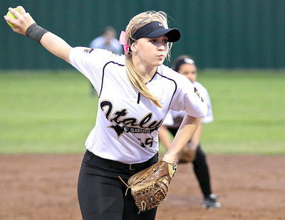 Image: Jaclynn Lewis(15) keeps the pressure on from the hill.