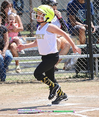 Image: Ella Hudson reaches home plate for Italy’s Coach Pitch Girls.