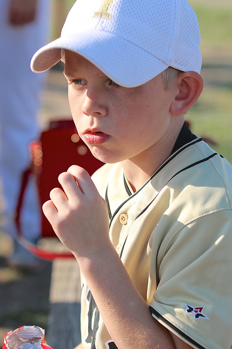 Image: Dustin Duke is all focus whether he’s competing in an IYAA baseball game or simply conquering a bag of Cheese Its.