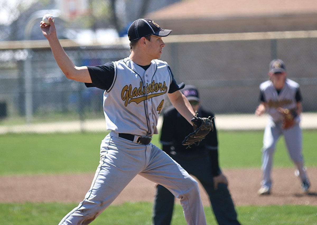 Image: Ryan Connor(4) tries to catch an Eagle runner nesting to far off the first-base bag.