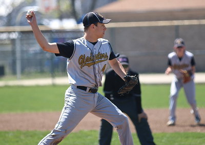 Image: Ryan Connor(4) tries to catch an Eagle runner nesting to far off the first-base bag.