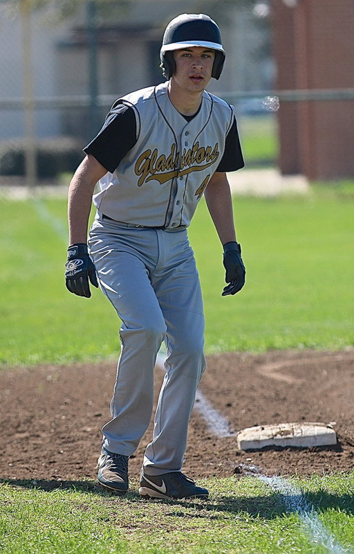 Image: Ryan Connor(4) makes his approach from third-base as he prepares to race home.