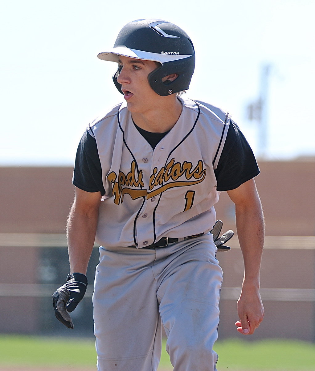 Image: Levi McBride(1) makes his way back to first-base but steals second on his next attempt.