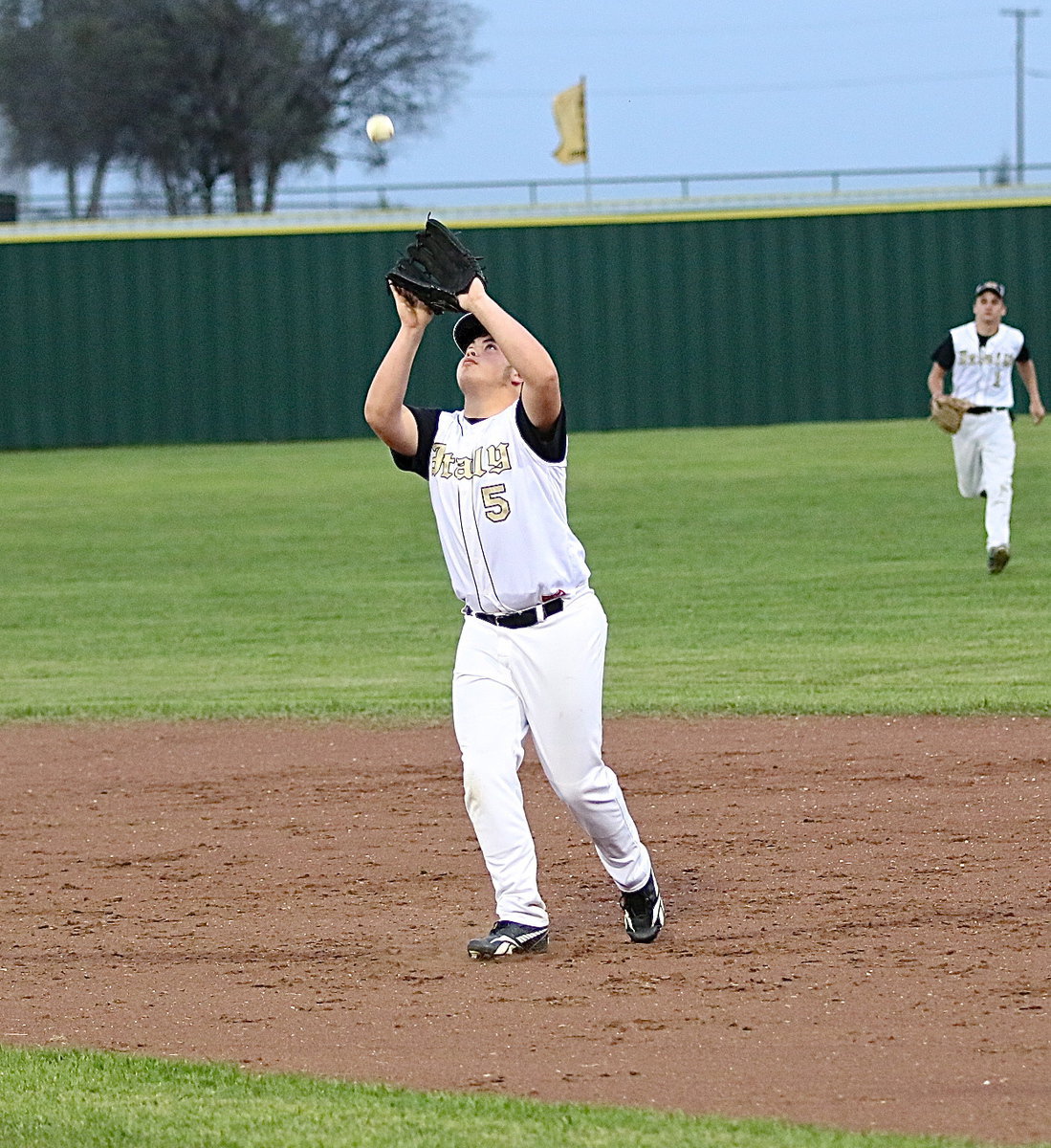Image: Senior second-baseman Zain Byers(5) secures a popup for an Italy out.