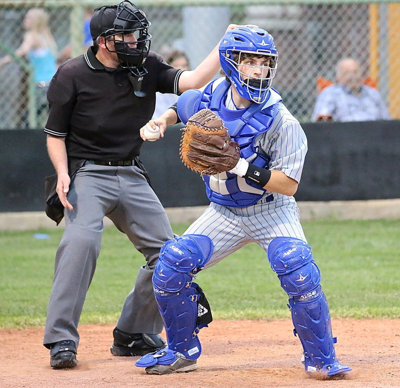 Image: Milford catcher Bryan Fedrick holds a Gladiator runner at first-base with both sides watching each other closely thru several scoreless innings.