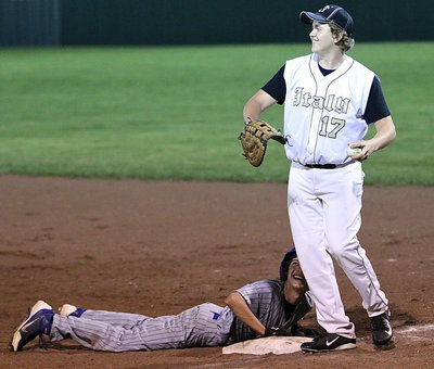Image: Both players get a laugh after Bailey Walton(17) tried to trick the Bulldog runner into stepping off the bag.