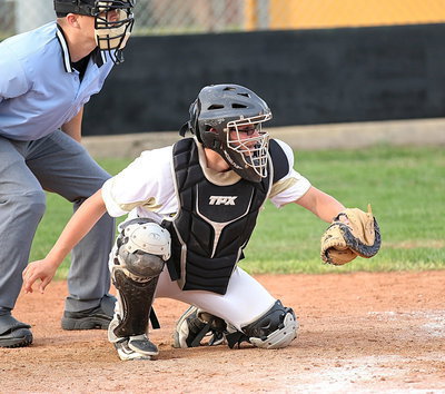 Image: Eli Garcia(3) pulls in a strike three for the third out from pitcher Kenneth Norwood, Jr. to keep the game tied 7-7 going into Italy’s final at bat.