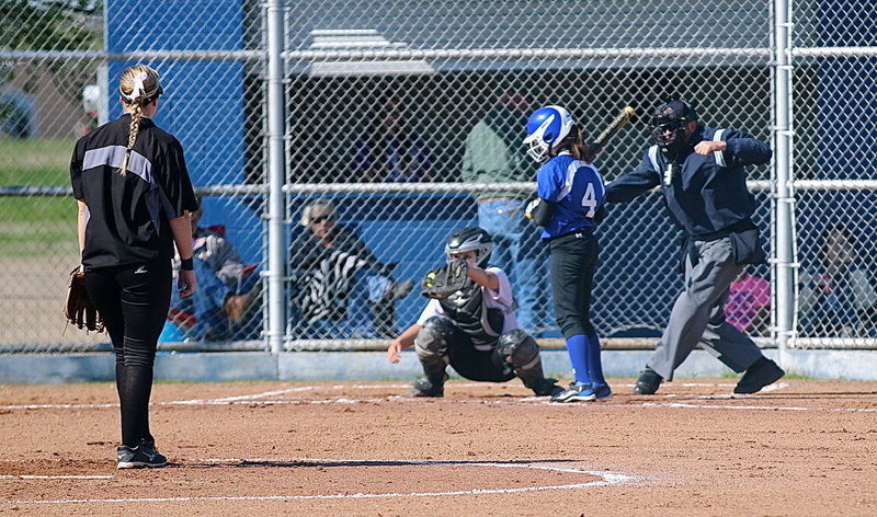 Image: Lady Gladiator catcher Lillie Perry(9) pulls in a third strike call against a Frost batter from pitcher Jaclynn Lewis(15) early in the game.