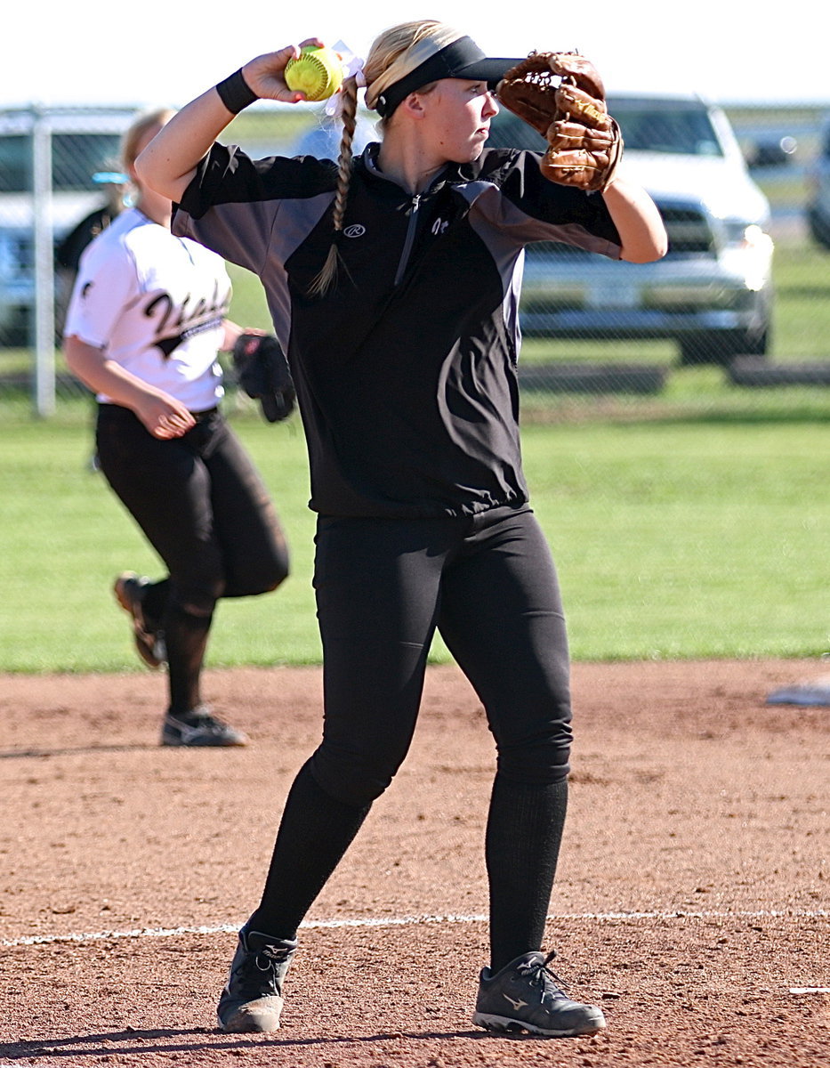 Image: Jaclynn Lewis(15) covers another grounder hit back to the mound and then again throws to teammate Paige Westbrook covering first-base for an out.
