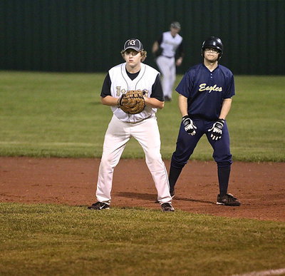 Image: Senior Gladiator first-baseman Bailey Walton(17) helps keeps the Eagle offense grounded.