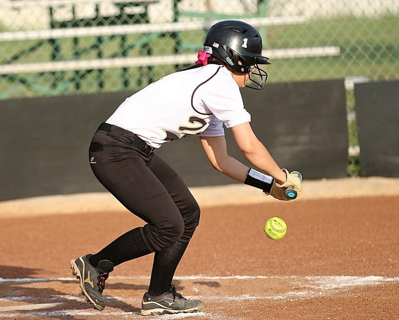 Image: Bailey Eubank(1) lays down a bunt down the third baseline and then sprints to first-base for a single.