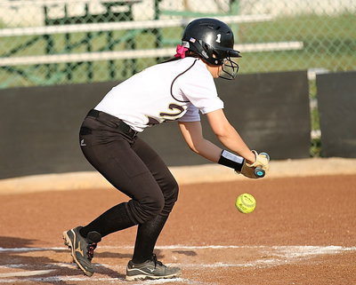Image: Bailey Eubank(1) lays down a bunt down the third baseline and then sprints to first-base for a single.