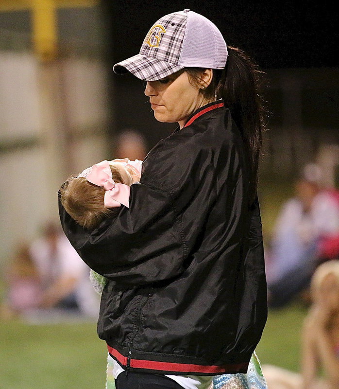Image: Lauren Cady, lovingly holds precious Maddox, while sporting the new adjustable plaid cap with the Gladiator logo embroidered and centered on the front. It’s just a great cap for making special memories while wearing!