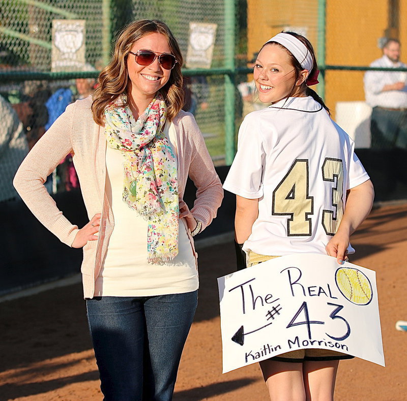 Image: Alumni Lady Gladiator #43 Kaitlin Morrison is receives special recognition from current Lady Gladiator Bailey Eubank(43).
