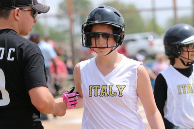 Image: Assistant coach,  JV Gladiator and big bro, Austin Crawford offers words of encouragement to his baby sis, Alyssa Crawford.