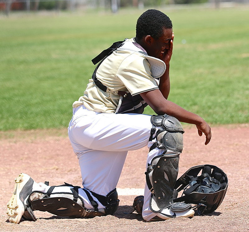 Image: Sometimes, you just need to laugh. Kendrick Norwood gets a chuckle after a miscue by one of his teammates.