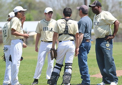 Image: Coaches, Jason Escamilla and Kenneth Norwood, Sr., discuss lineup changes with their squad.