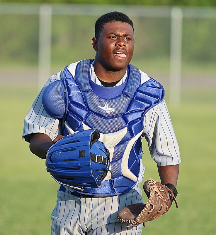 Image: Bulldog catcher Jacarvus Gates(7) checks with his pitcher and then returns to the plate.