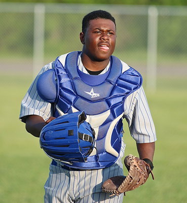 Image: Bulldog catcher Jacarvus Gates(7) checks with his pitcher and then returns to the plate.