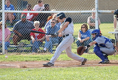 Image: Gladiator Ryan Connor(4) with a thunderous rip to help keep the pressure on the Bulldogs.