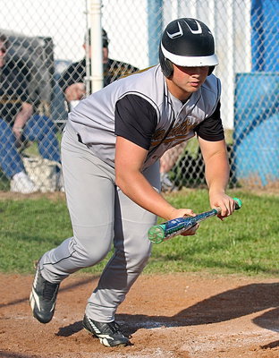 Image: Zain Byers(20) places a perfect bunt down the first-base line to move runners. Byers was called out for obstruction after being ruled to far inside the baseline. Teammates basically told Byers to go on a diet as he made his way back to the dugout with the Bulldog dugout chuckling on that one.