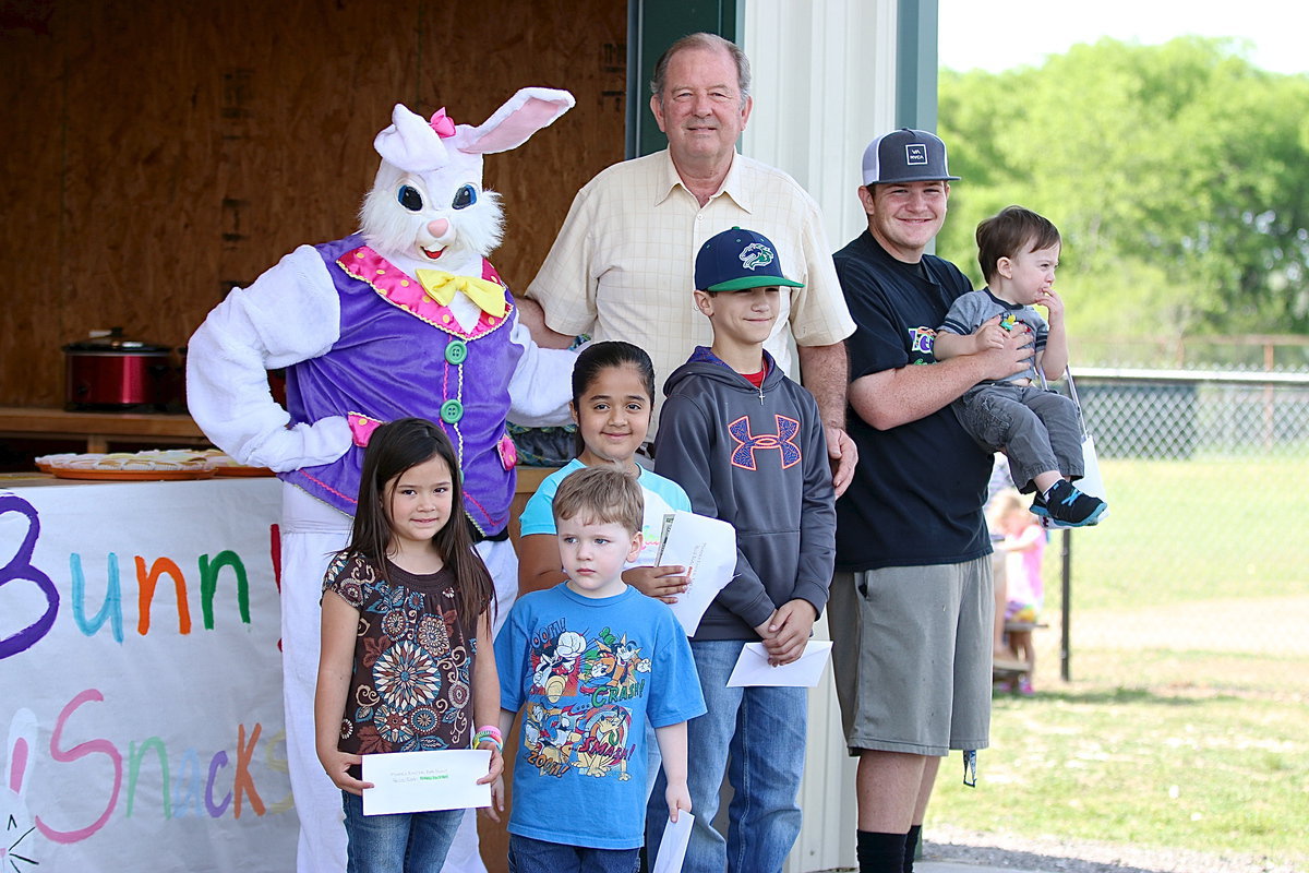 Image: City of Italy Mayor James Hobbs gets help from the Easter Bunny, Breyanna Beets, and from Gladiator Baseball star Tyler Vencill to help congratulate the prize winners who found the money eggs!