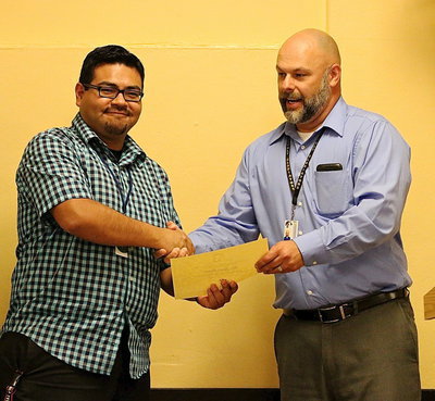 Image: Jesus Perez is also presented a certificate from Principal Lee Joffre recognizing he and the Gladiator Regiments Band’s accomplishments for the school year.