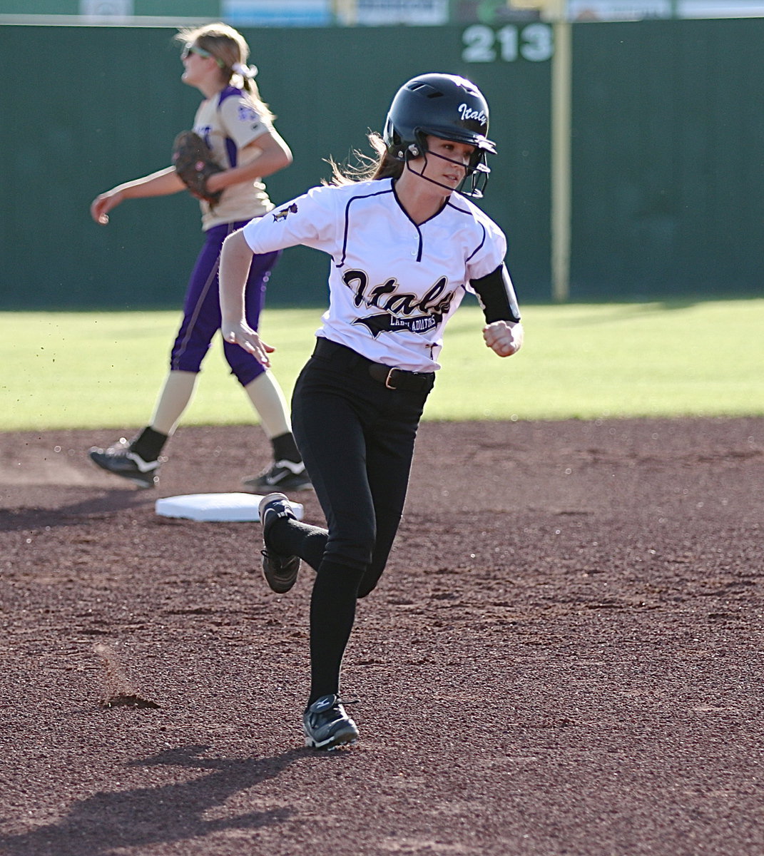 Image: Lady Gladiator Cassidy Childers(3) rounds the bases with head coach Wayne Rowe giving her the green light to go home.