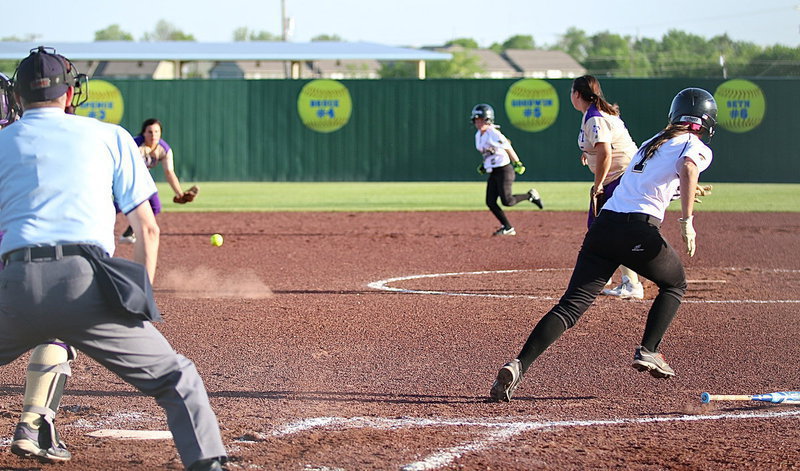 Image: Bailey Eubank(1) puts pressure on the Mart defense with a grounder to short.