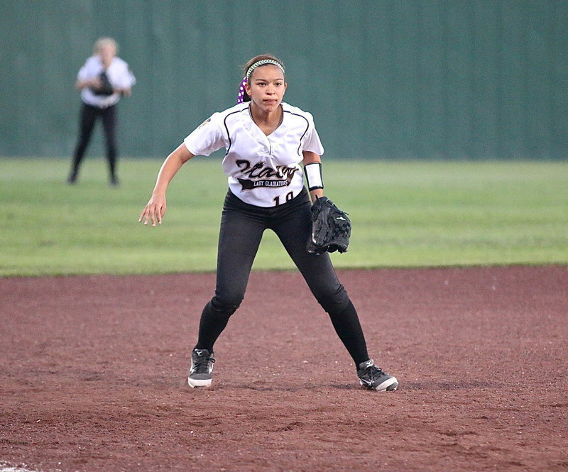 Image: Italy’s April Lusk(18) is ready to react at third.