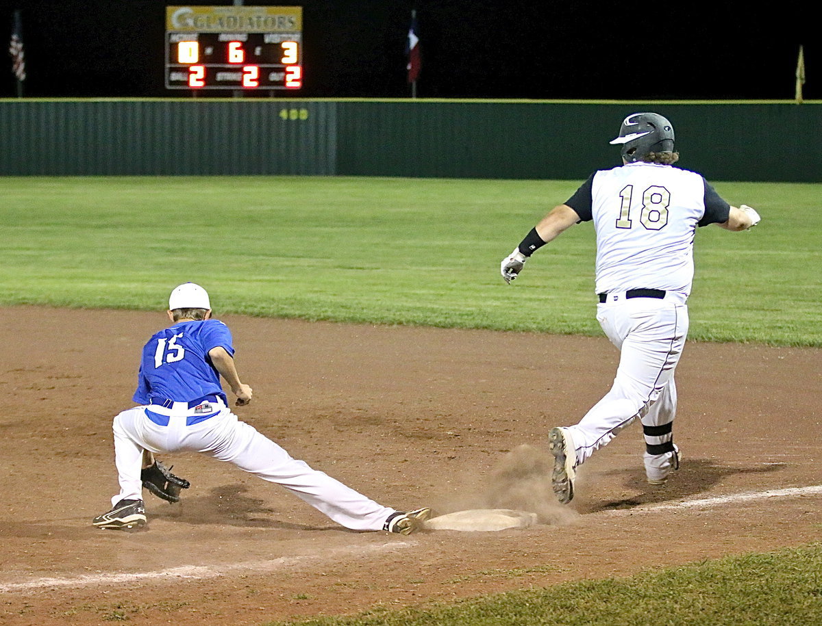 Image: Itay’s John Byers(18) beats the attempted throw to first-base with Frost unable to stop him.