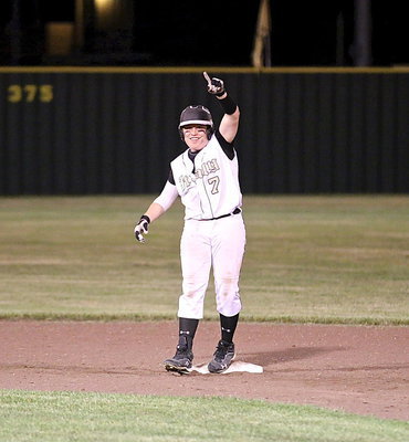 Image: John Escamilla(7) acknowledges his dugout buds and their appreciation as he stands triumphantly atop second base after recording a double.