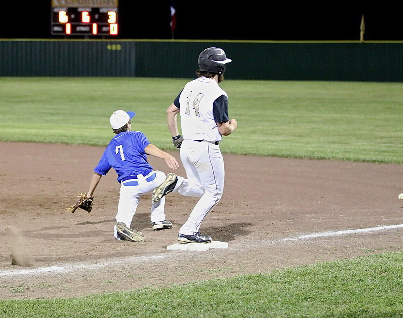 Image: Kyle Fortenberry(14) hits to reach first-base and then heads to second after the overthrow.