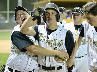 Image: Senior Bailey Walton(1) gives his cousin Levi McBride(1) a huge hug after McBride’s home run effort. It was the momentum Italy needed to begin their final assault on the Polar Bears.