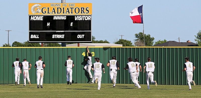 Image: The Gladiators take a pre-game lap out to the new scoreboard to warmup and for a little bonding time.