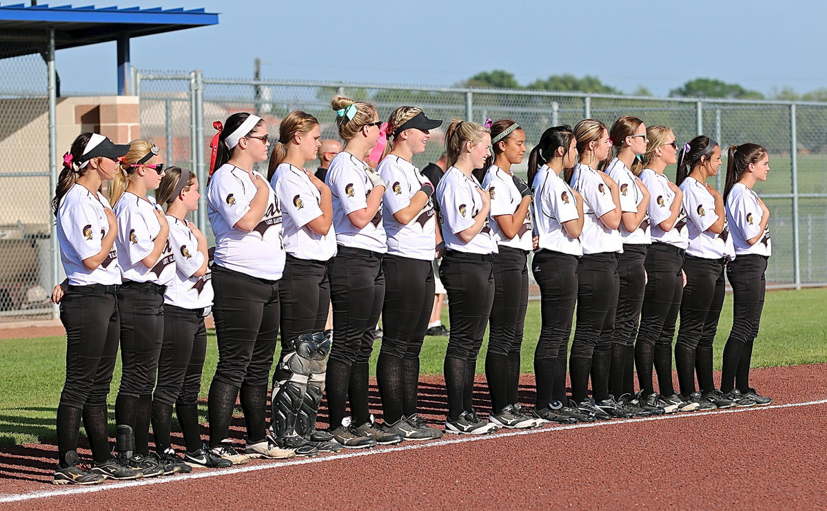 Image: The Lady Gladiators honor the flag and all it represents.