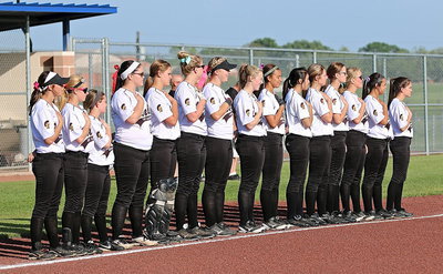 Image: The Lady Gladiators honor the flag and all it represents.