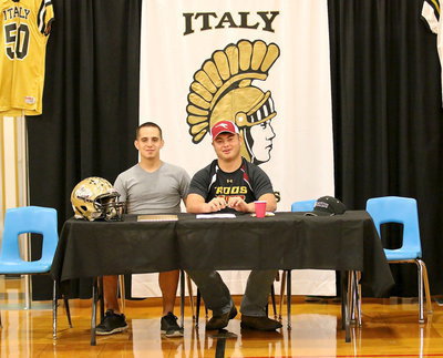 Image: Fellow Gladiator Cody Medrano shares in the moment with his tackling compadre Zain Byers after Byers signed his commit to play football for Austin College. Both played IYAA pee-wee football together, select football, then junior high, JV and varsity football together.