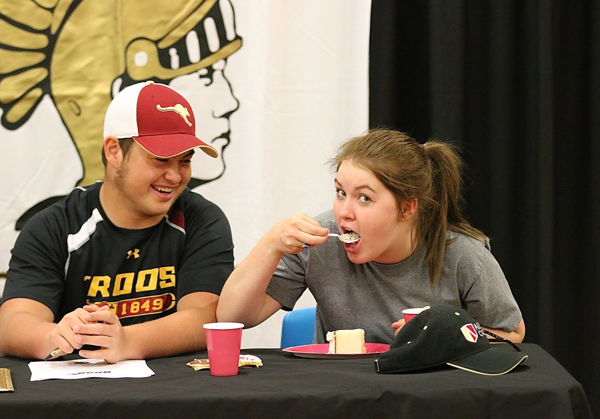 Image: Now it’s a party! Taylor Turner shares the moment with her senior classmate Zain Byers, but she ain’t sharing no cake!