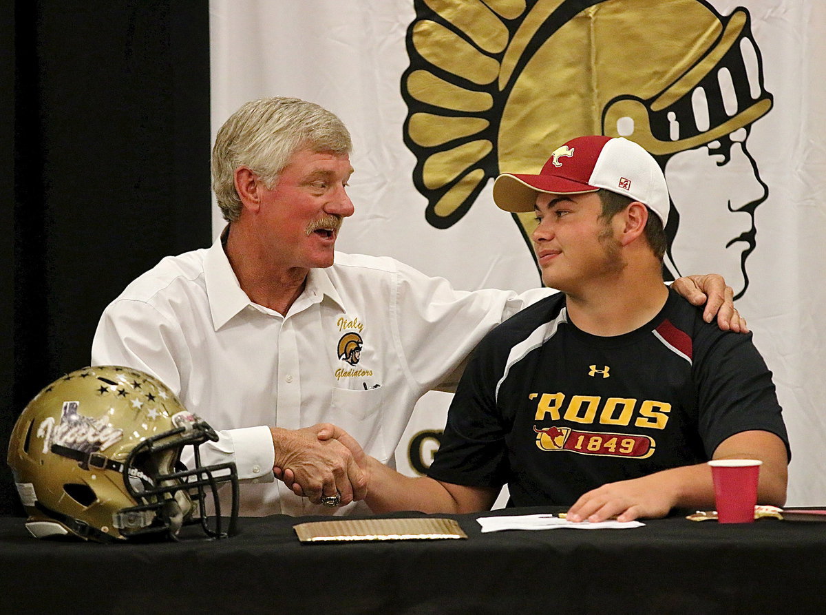 Image: Italy ISD AD/HFC Charles Tindol congratulates Zain Byers on his becoming a Kangaroo.
